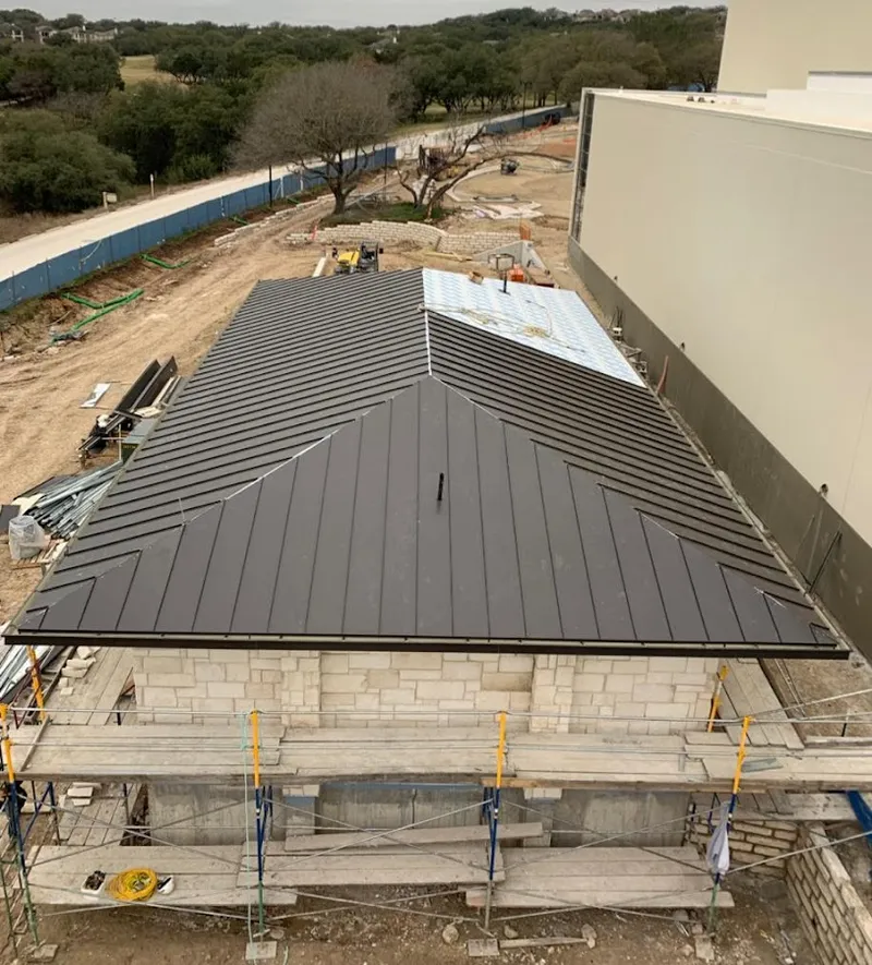 Metal roof new construction with scaffolding in Elma
